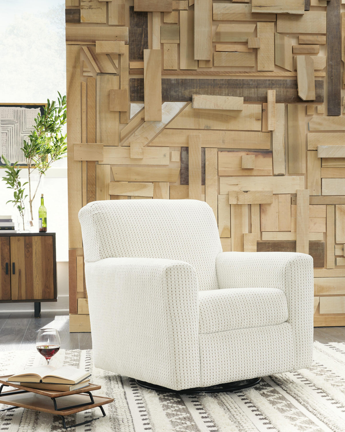 Herstow Swivel Glider Accent Chair - A3000365 - product view or room setting; only accent chair included (supplier image 2)
