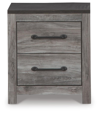 Bronyan Nightstand - B1290-92 - product view or room setting; only nightstand included (supplier image 4)
