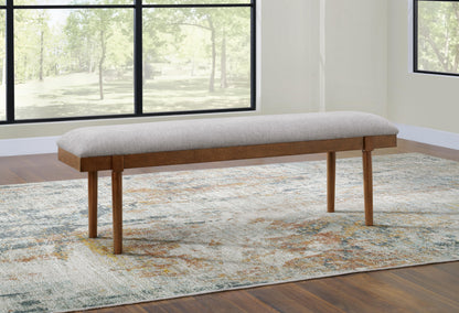 Lyncott 59" Upholstered Dining Bench - D615-00 - product view or room setting; only benche included (supplier image 2)