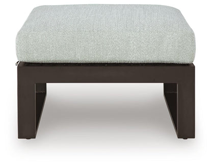 Beachloft Outdoor Ottoman with Cushion - P490-814 - product view or room setting; only outdoor ottoman included (supplier image 4)