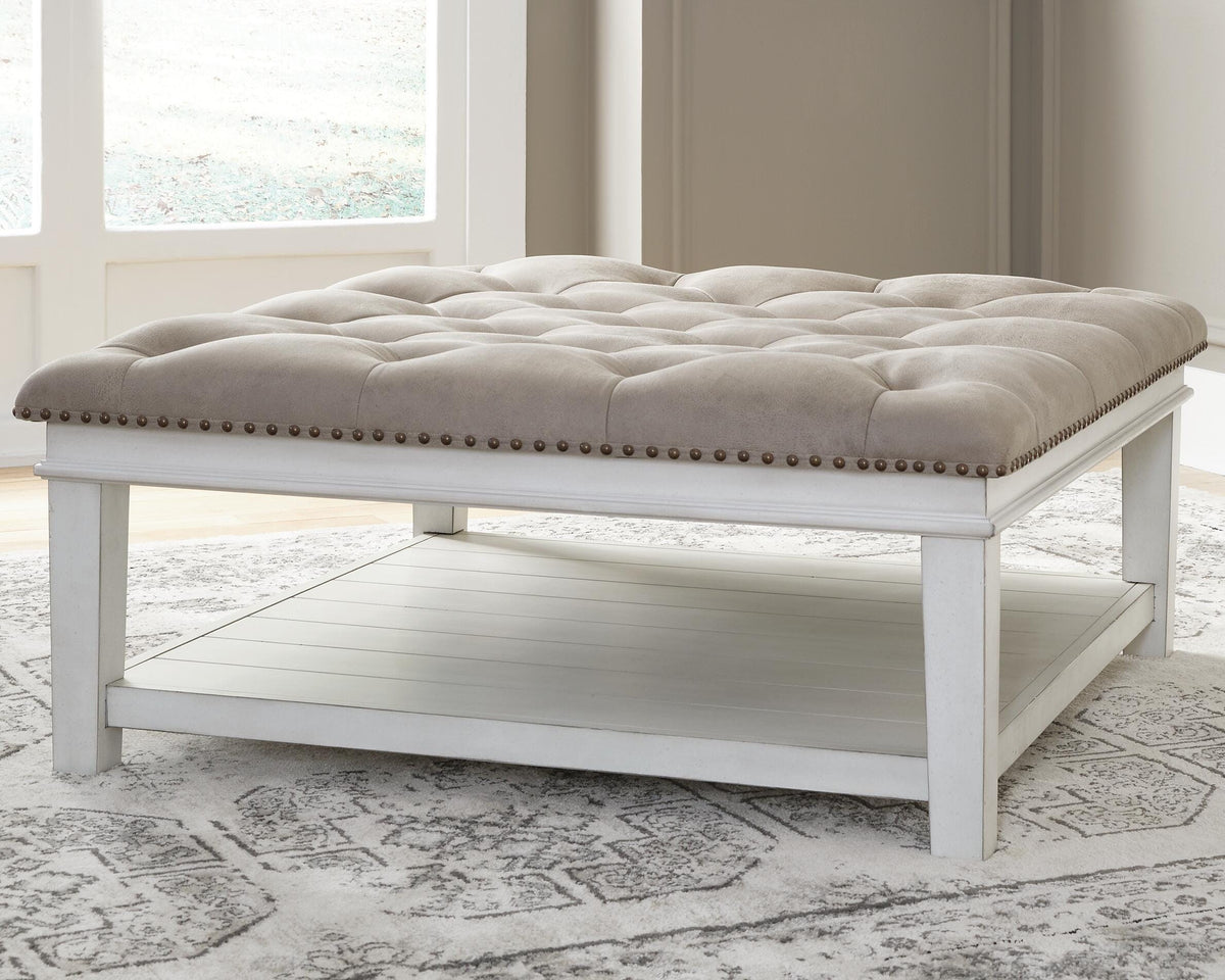 Kanwyn Upholstered Ottoman Coffee Table - T937-21 - product view or room setting; only coffee table included (supplier image 2)