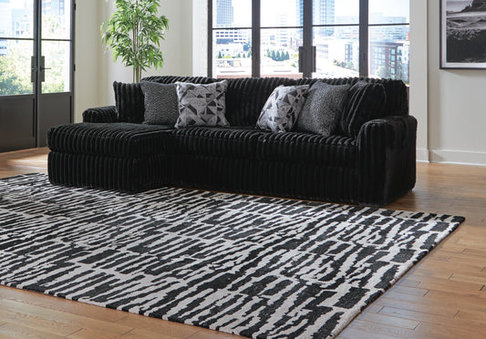 Midnight-Madness two-piece sectional 98103S1 — Onyx black, chaise on viewer left
