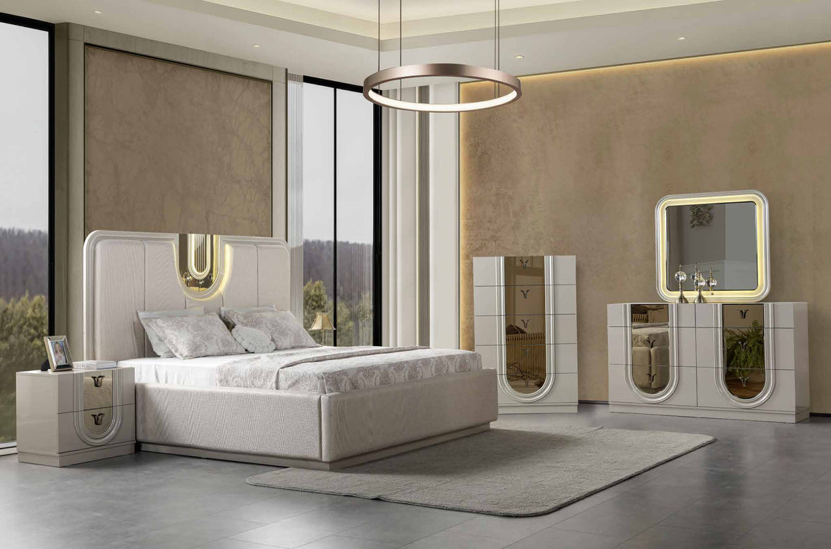 Lesli Beige bedroom collection shown with bed, dresser, mirror, chest and one nightstand. Photographed bed size not verified.