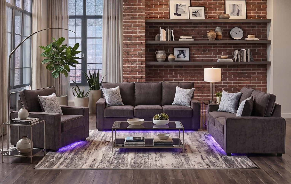 Rita Charcoal collection room scene showing the chair at left, sofa at center and loveseat at right, with other room furniture and decorative accessories.