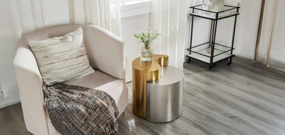 Ying Yang Gold & Silver End Table in a furnished room setting.