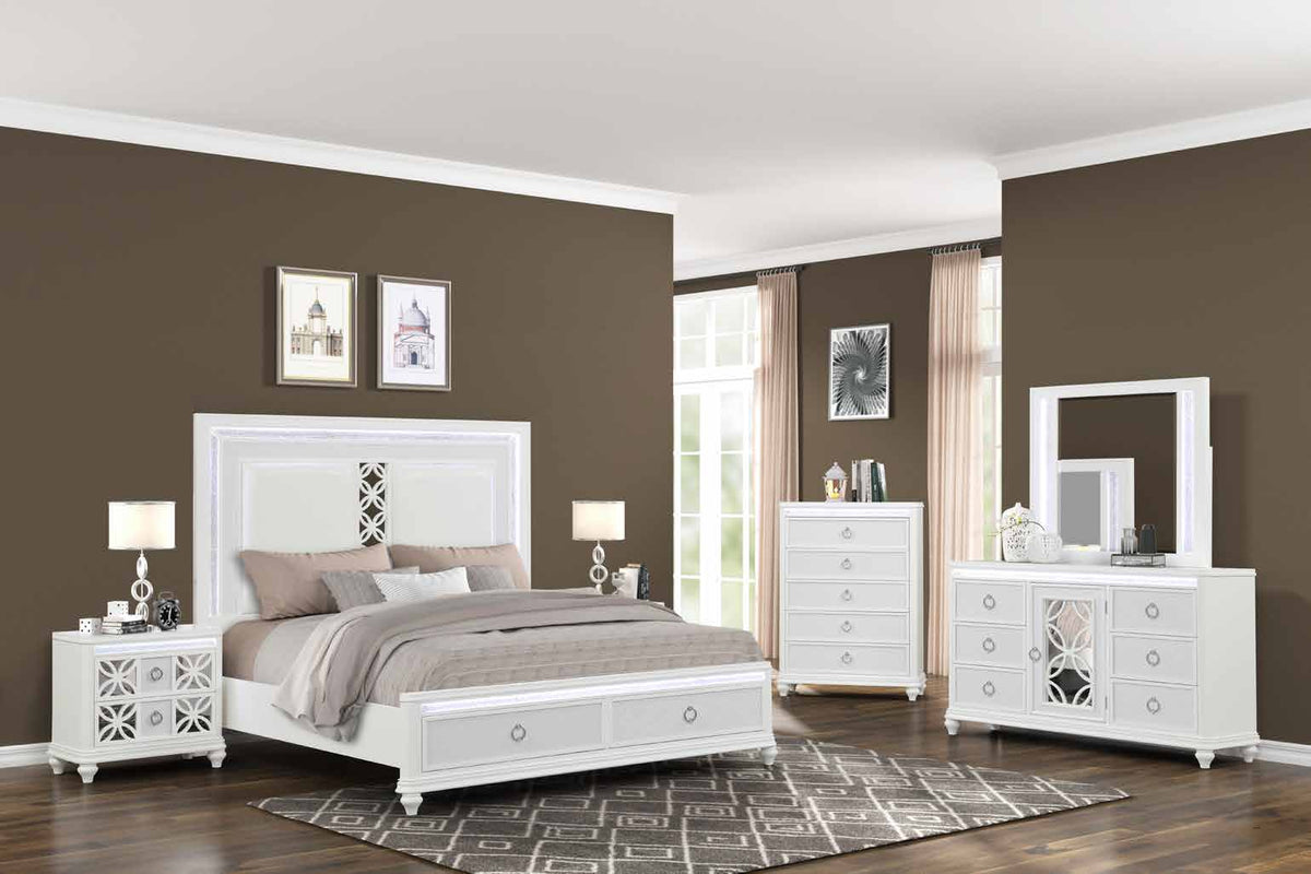 Abigale White room scene with storage bed, dresser, dresser mirror, chest and standard nightstands, with the right nightstand mostly obscured. Photographed bed size is not verified.